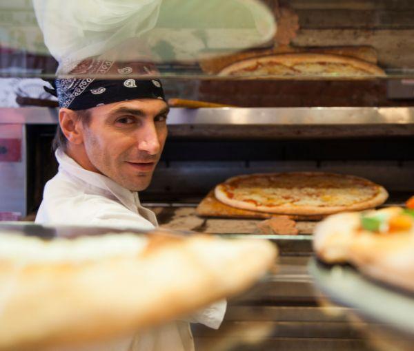a man cooking pizza and Starting a Pizza Shop